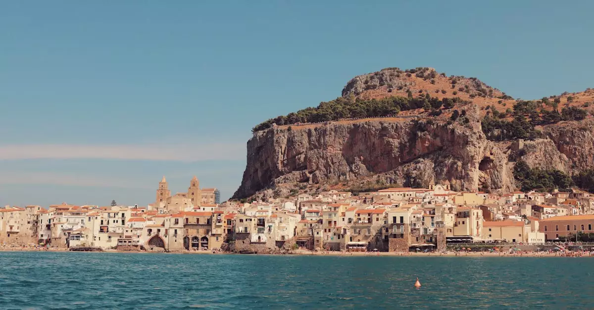 Explore the stunning seaside architecture of Cefal&ugrave;, Sicily, with rocky backdrops and historic charm.