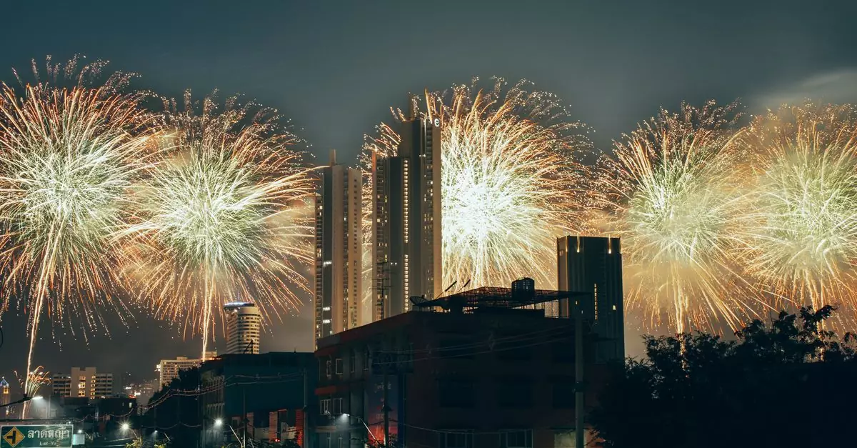 Vibrant fireworks light up the Bangkok skyline, celebrating New Year in Thailand's capital city.