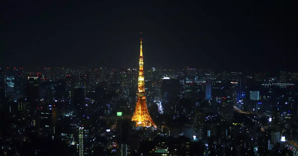 Stunning view of Tokyo Tower lit up, surrounded by the city's nightscape.