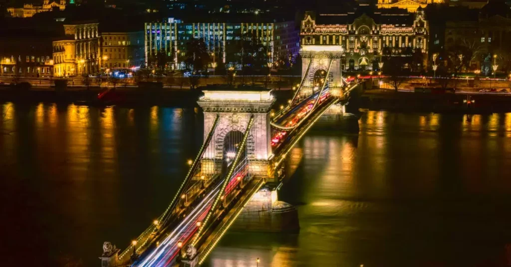Stunning long exposure night shot of the Széchenyi Chain Bridge, showcasing illuminated architecture and city lights in Budapest.