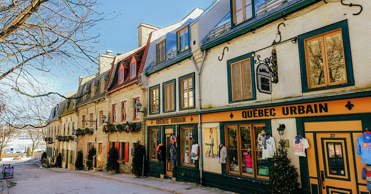Picturesque winter scene of historic Rue du Petit-Champlain in Quebec City, showcasing colorful colonial-style architecture.