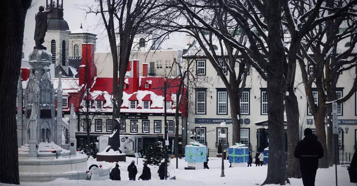 Snowy winter day in Old Quebec City with historic architecture and a statue in a lively square.