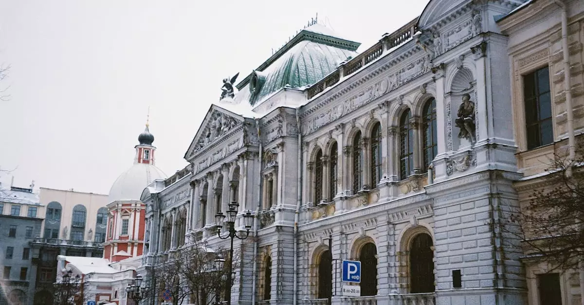 Ornate historic building with a snow-covered street in a European city during winter.