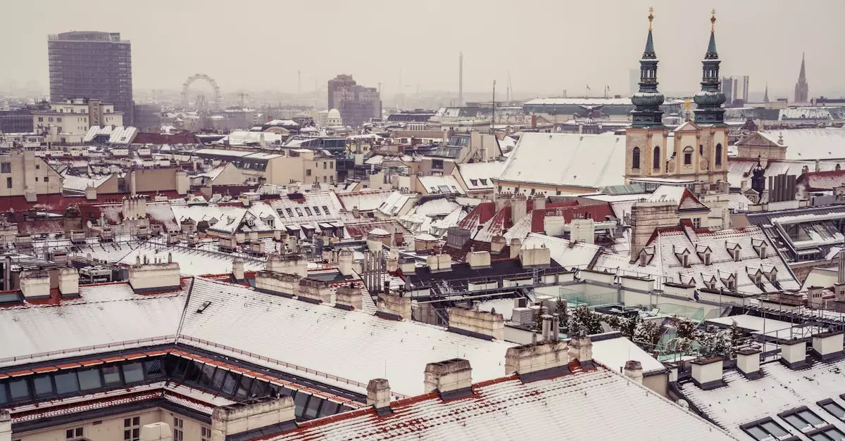 Aerial view of Vienna's rooftops covered in snow, highlighting historic architecture.