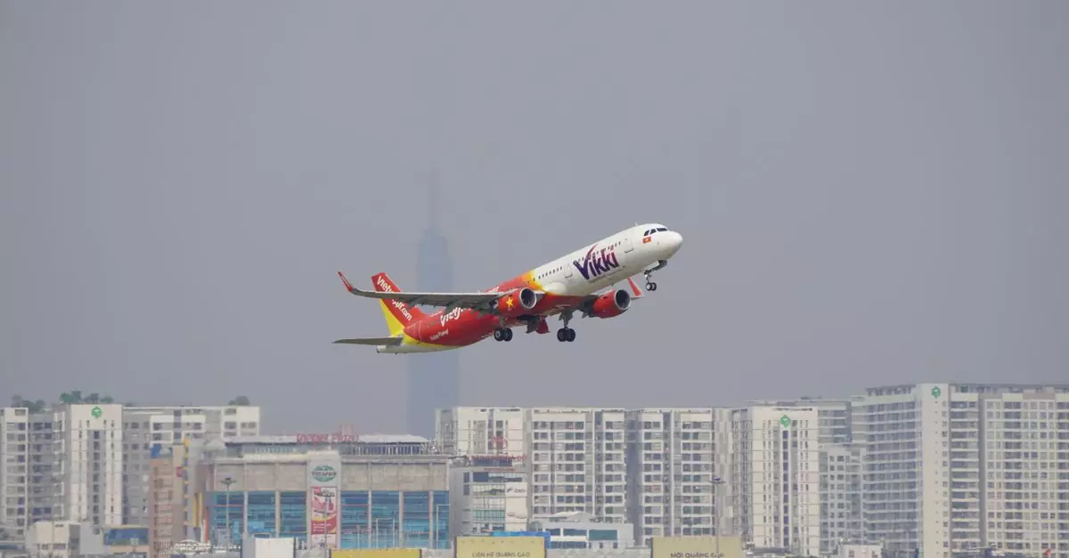 A vibrant airplane takes off against a cityscape backdrop with high-rise buildings on a clear day.