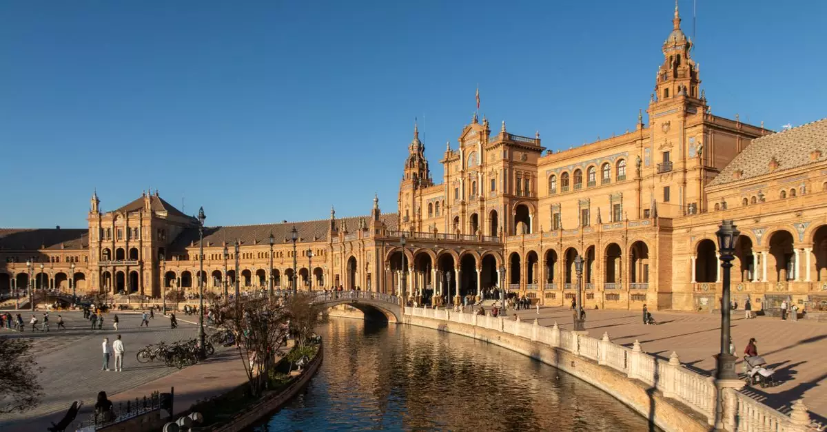 A breathtaking view of Plaza de Espa&ntilde;a in Seville, showcasing its stunning architecture and canal.