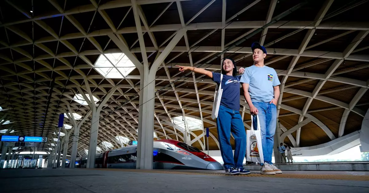 High-speed train at Jakarta's modern railway station with travelers and unique architecture.
