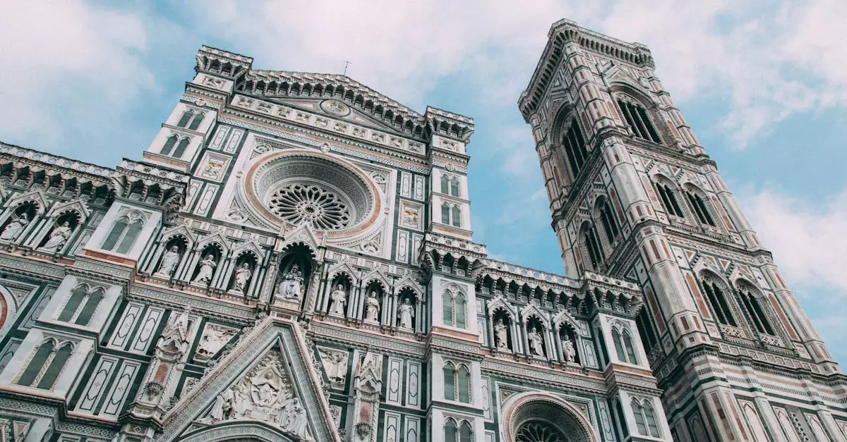 Capture of the Florence Cathedral's ornate facade and bell tower against a blue sky in Italy.