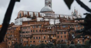 Captivating view of Siena Cathedral with surrounding medieval architecture in Tuscany, Italy.