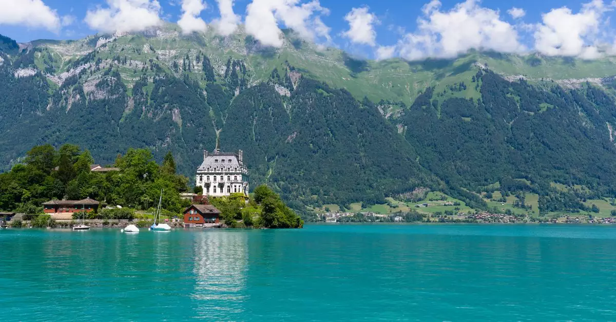 Scenic view of Iseltwald on Lake Brienz with mountains in the background.