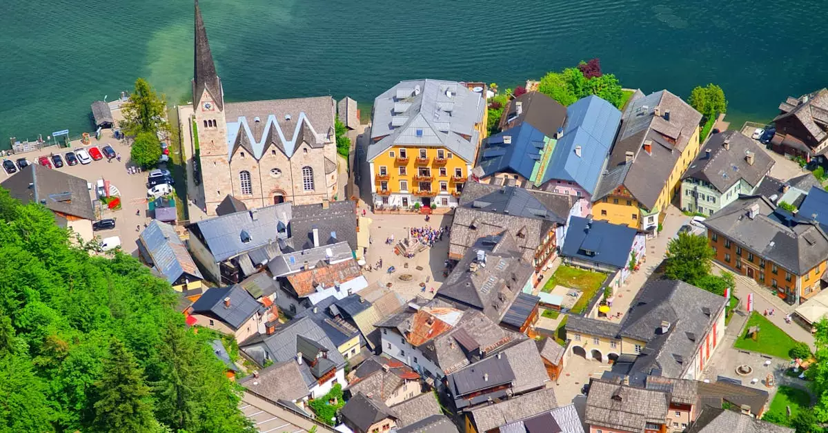 Scenic aerial view of Hallstatt, Austria with iconic lake and historic Lutheran church.