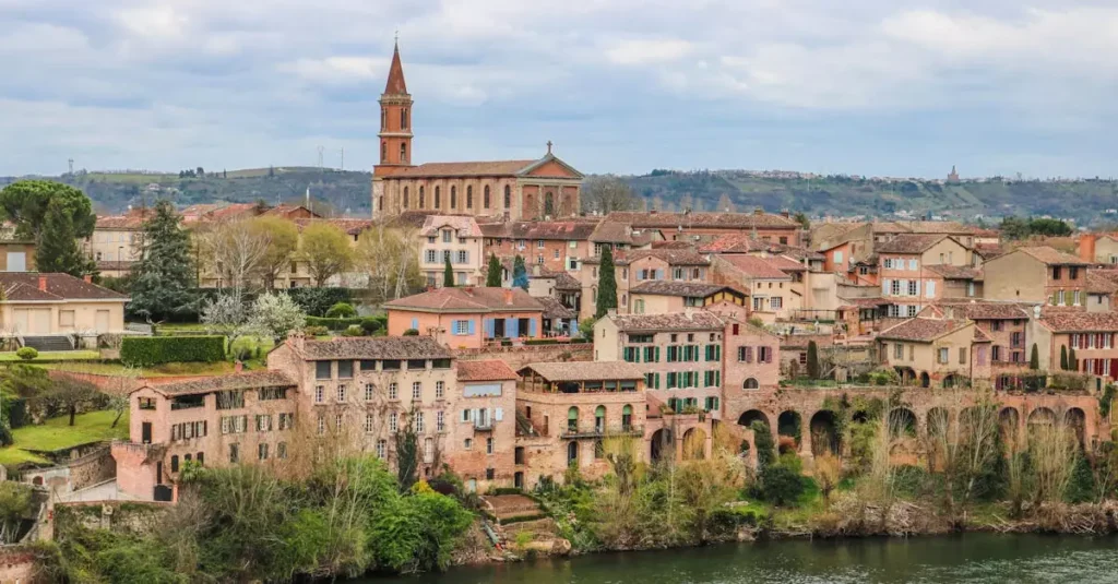 Best UNESCO Villages Europe: Timeless Charm 2 Picturesque view of Albi's historic skyline and River Tarn with classic architecture and landmarks.