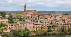 Picturesque view of Albi's historic skyline and River Tarn with classic architecture and landmarks.
