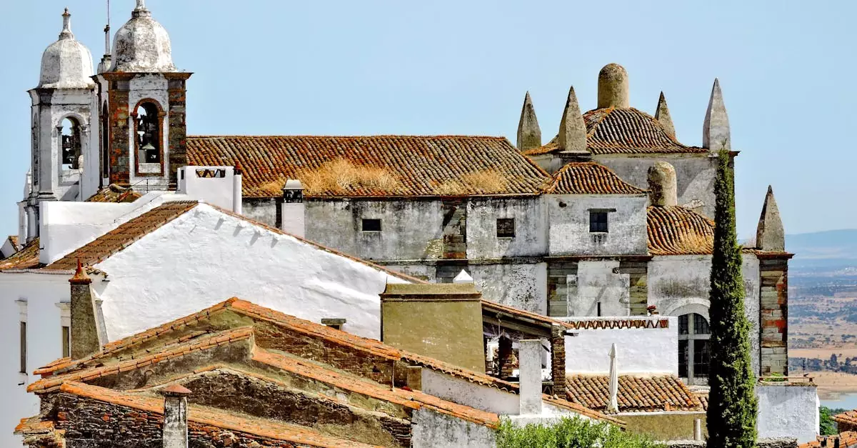 View of the historic Monsaraz Castle with scenic surroundings in Portugal's Alentejo region.