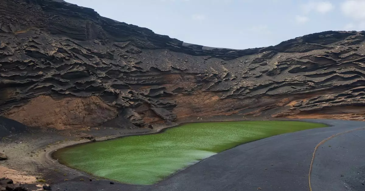 Scenic view of El Charco Verde, a green lagoon in a volcanic crater, Lanzarote, Spain.