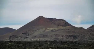 Explore the breathtaking volcanic landscape of Timanfaya National Park in Lanzarote, Spain.