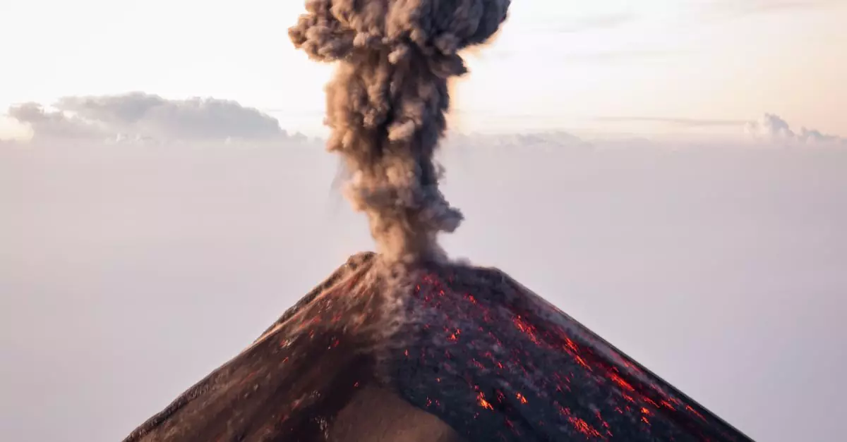 A stunning view of Volcán de Fuego erupting with dark smoke and lava against a sunset sky in Guatemala.