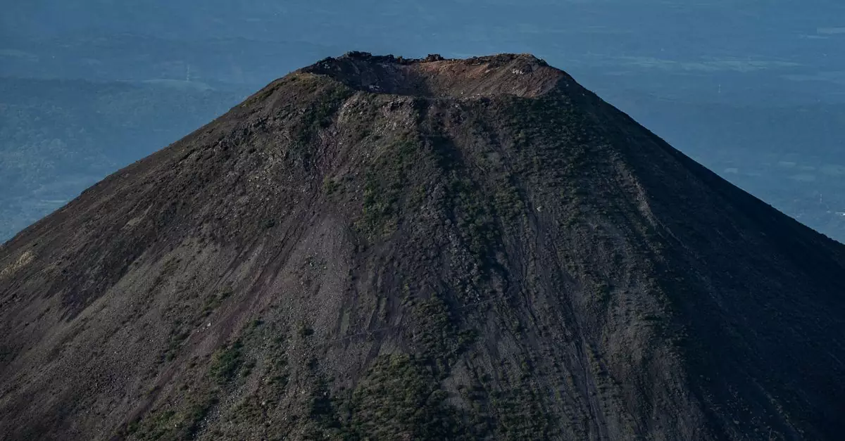 Stunning aerial photo of Izalco Volcano in El Salvador, showcasing its crater and rugged slopes.