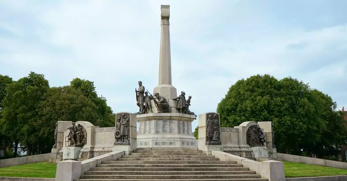 Historic Port Sunlight War Memorial in Bebington, England with surrounding greenery.