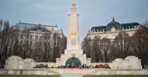 Soviet War Memorial with wreaths in Budapest, Hungary, framed by historic architecture.