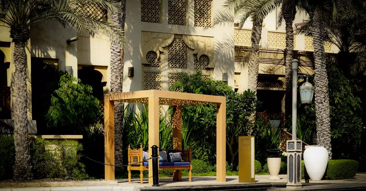 Elegant outdoor seating area with ornate architecture in a tropical resort setting.