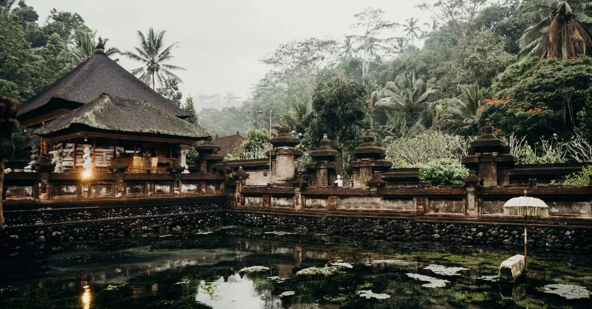 Explore the tranquil beauty of a Balinese water temple amidst lush greenery. Perfect for travel inspiration.
