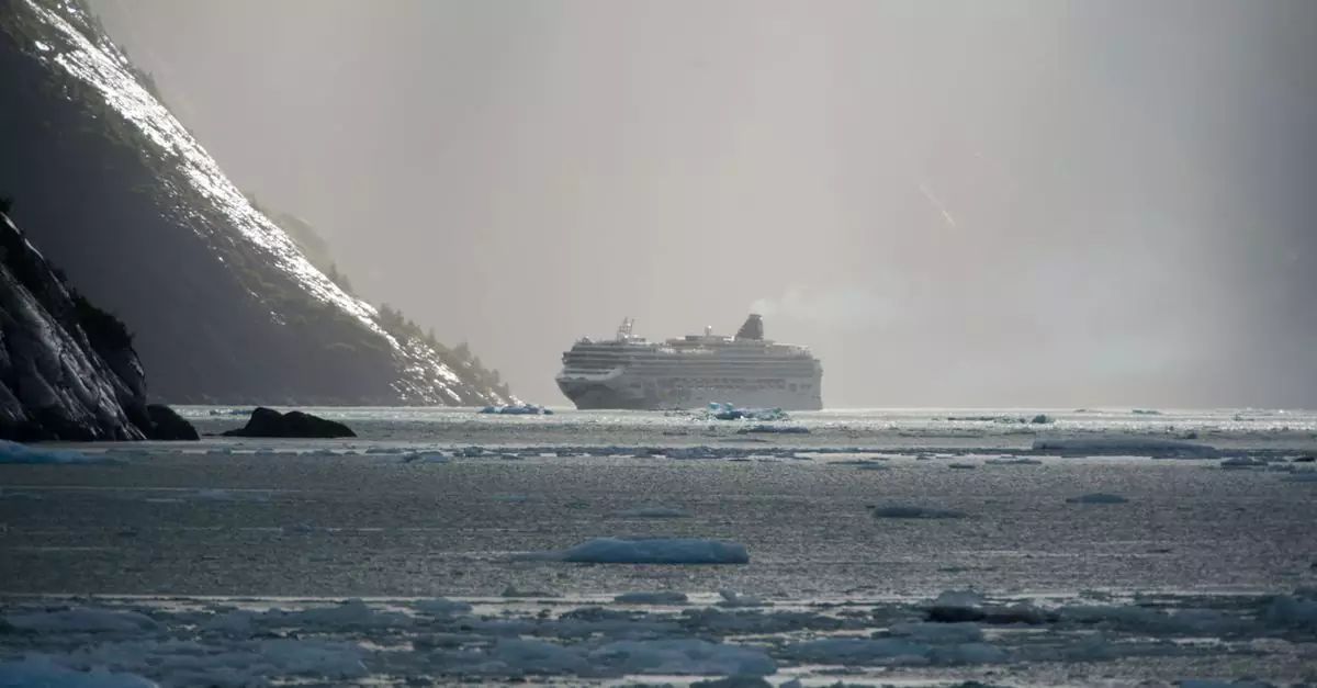 A cruise ship sails through icy Alaskan waters near Juneau under a misty gray sky.