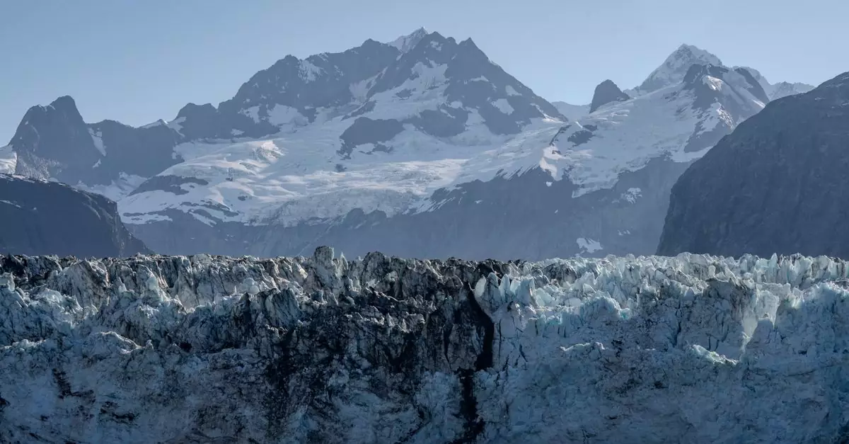 Breathtaking view of Glacier Bay with rugged ice formations and snow-capped mountains in Alaska.