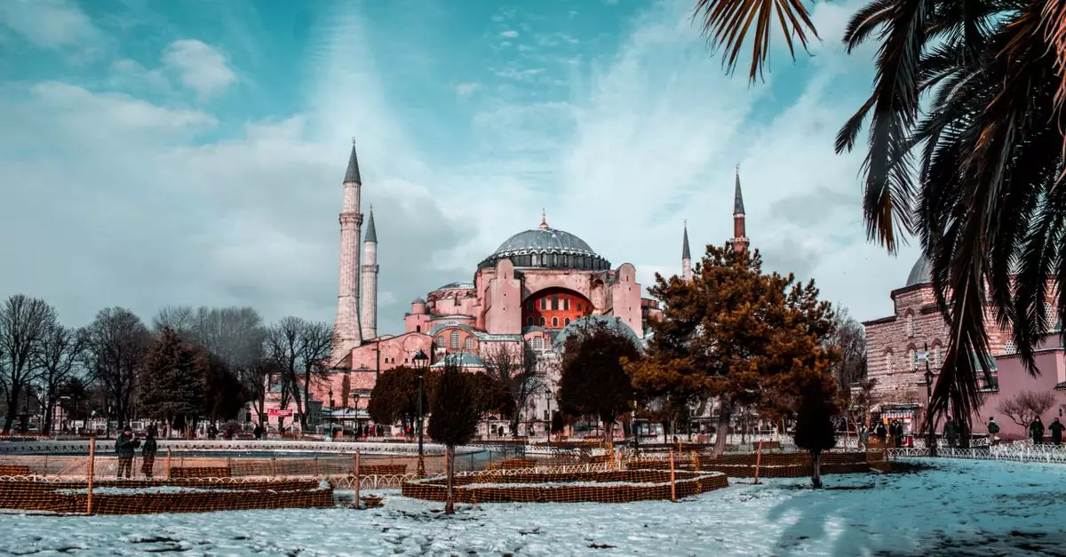 Captivating winter scene of Hagia Sophia with snow and blue skies in Istanbul, Turkey.