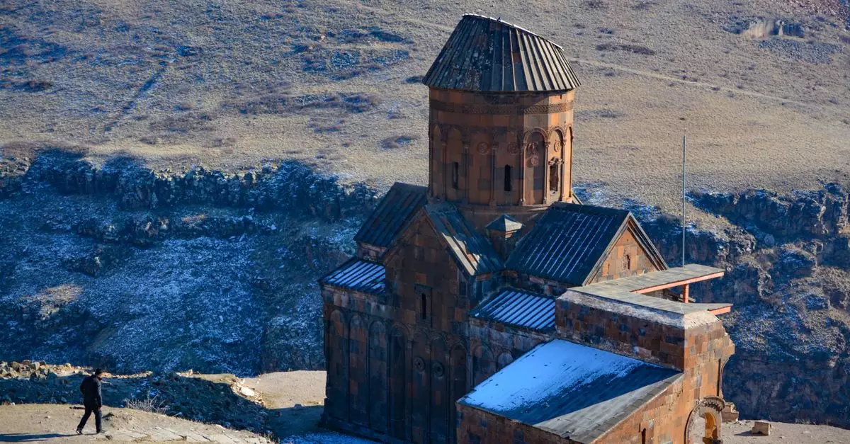 Ancient Ani Cathedral stands in a vast, rugged landscape in Kars, T&uuml;rkiye.