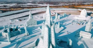 Stunning aerial view of ice sculptures at Harbin Ice Festival, China during winter.