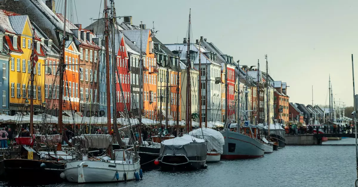 A vibrant winter view of Nyhavn Canal, Copenhagen, showcasing colorful buildings and boats.