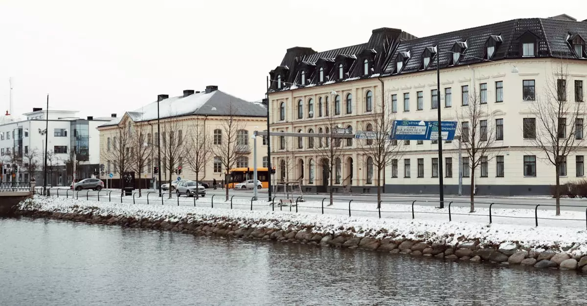 Picturesque winter view of historic buildings along a snowy canal in Malm&ouml;, Sweden.