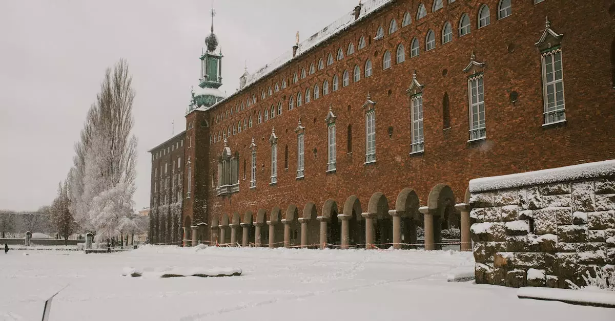 A picturesque view of Stockholm City Hall covered in fresh winter snow, capturing its historical architecture.
