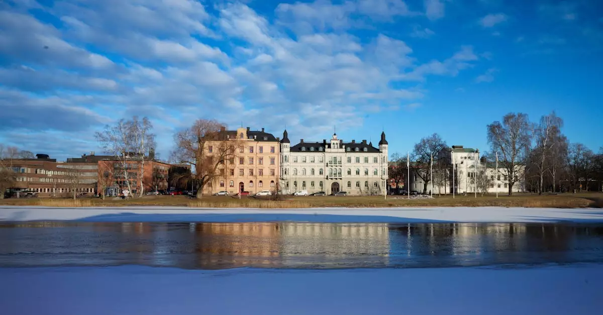 Winter view of historical buildings reflected on frozen water in Karlstad, Sweden.