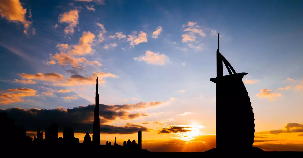 Silhouette of Dubai skyline featuring Burj Al Arab and Burj Khalifa at sunset.