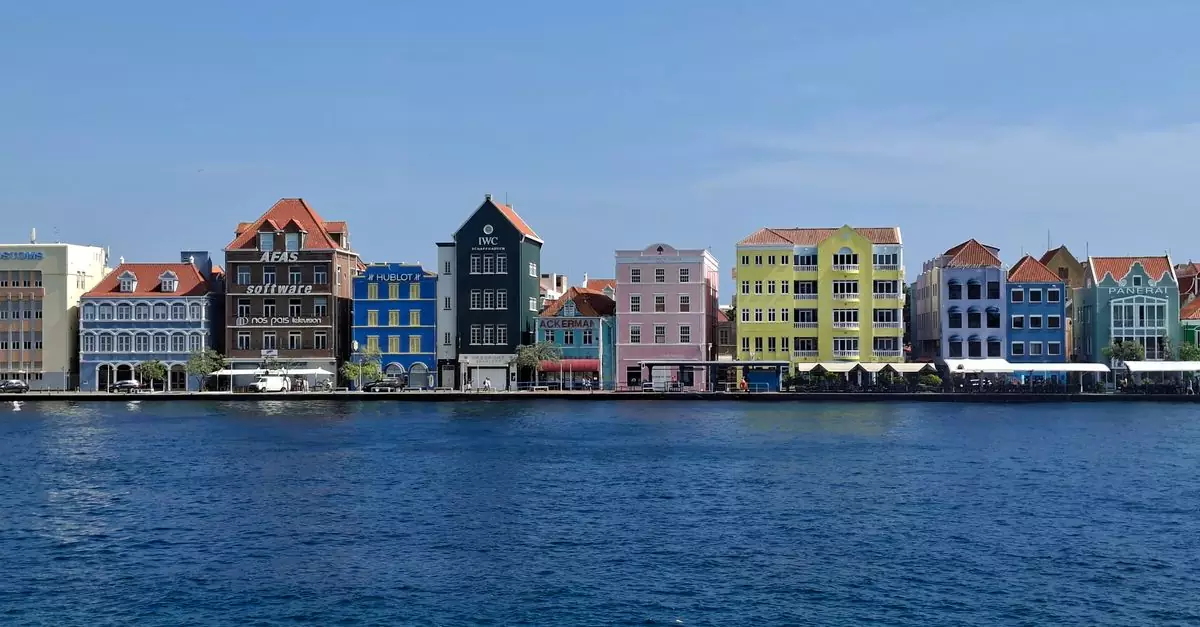 Vibrant Dutch colonial buildings along the waterfront in Willemstad, Curacao.
