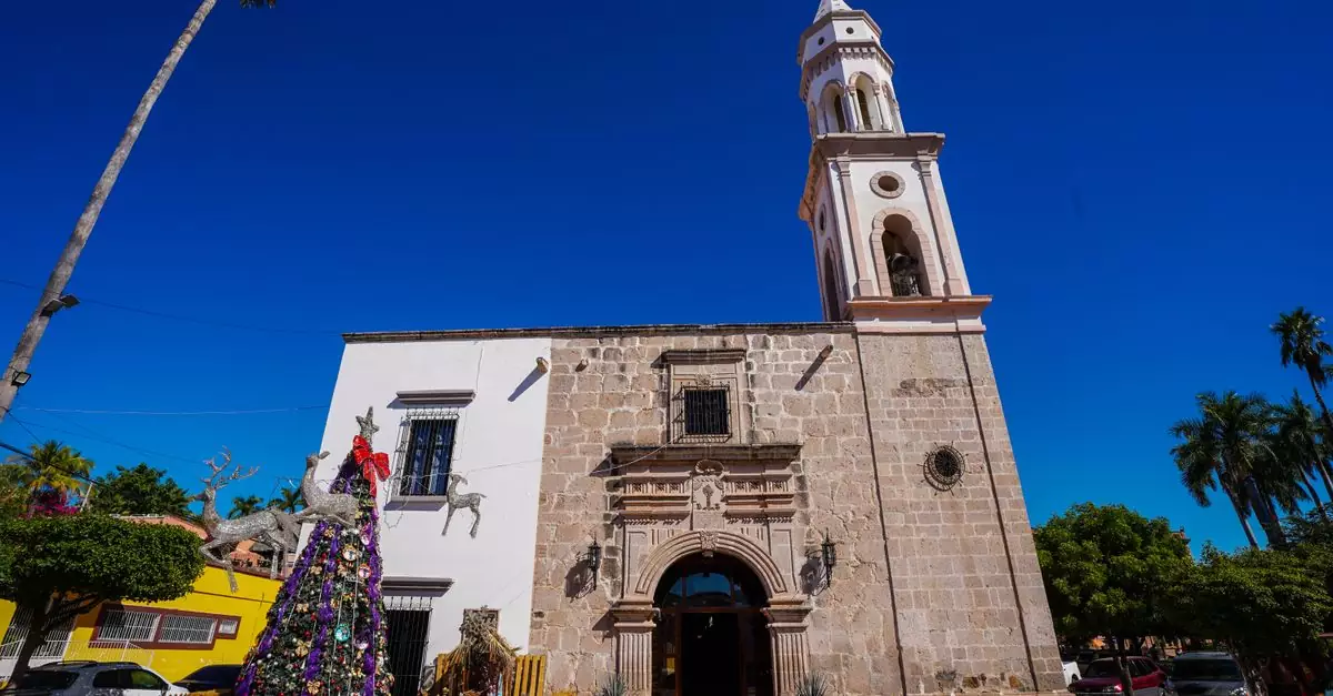 Beautiful historic church in Topolobampo, Sinaloa, Mexico with festive Christmas decorations.
