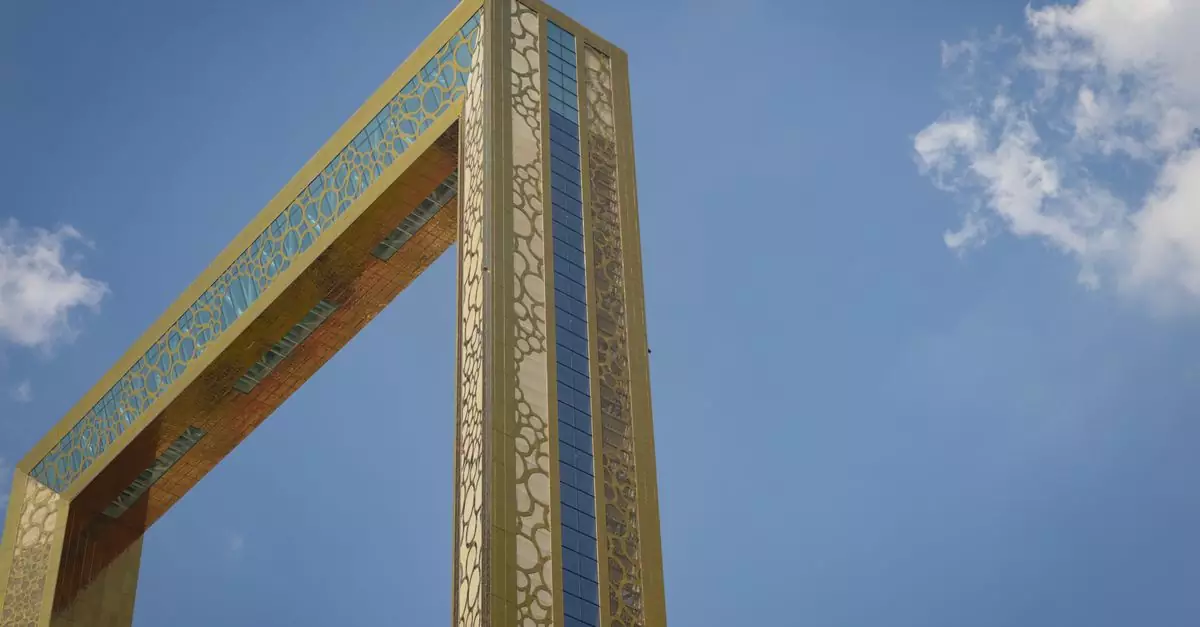 The Dubai Frame soaring against a clear blue sky, showcasing modern design and architecture.
