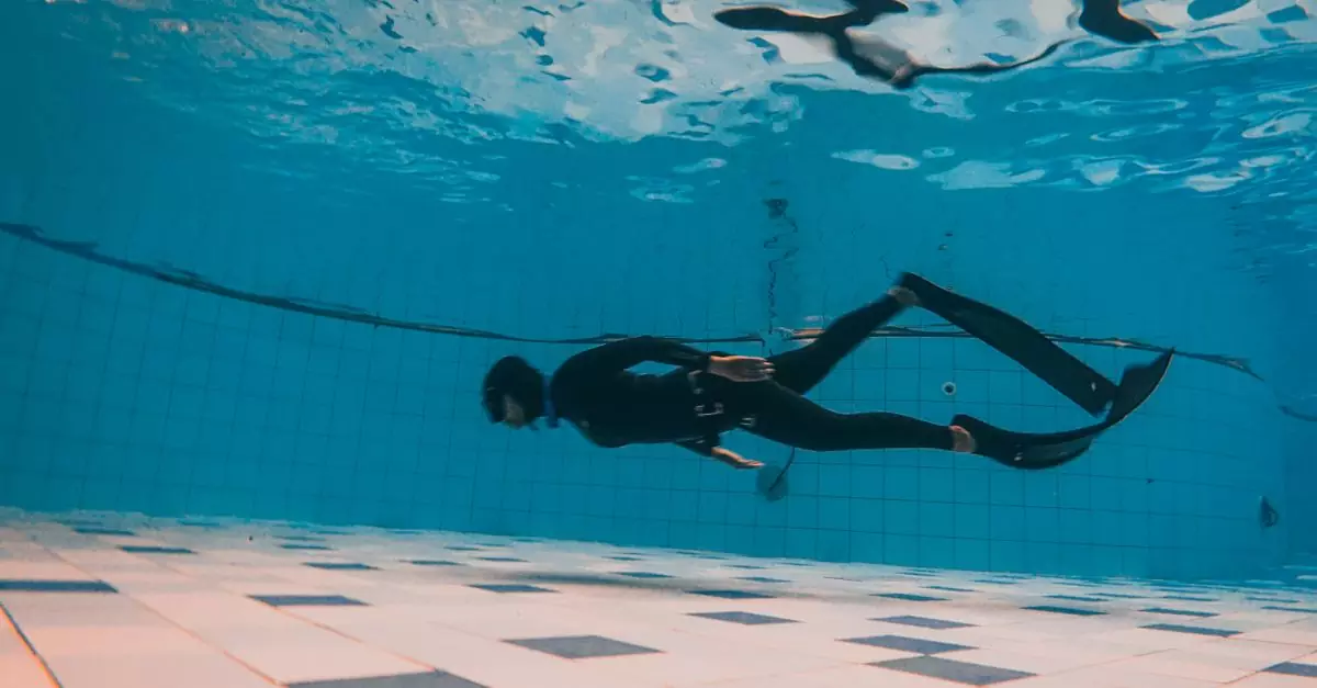 Deep dive under a swimming pool with a diver exploring the underwater world.