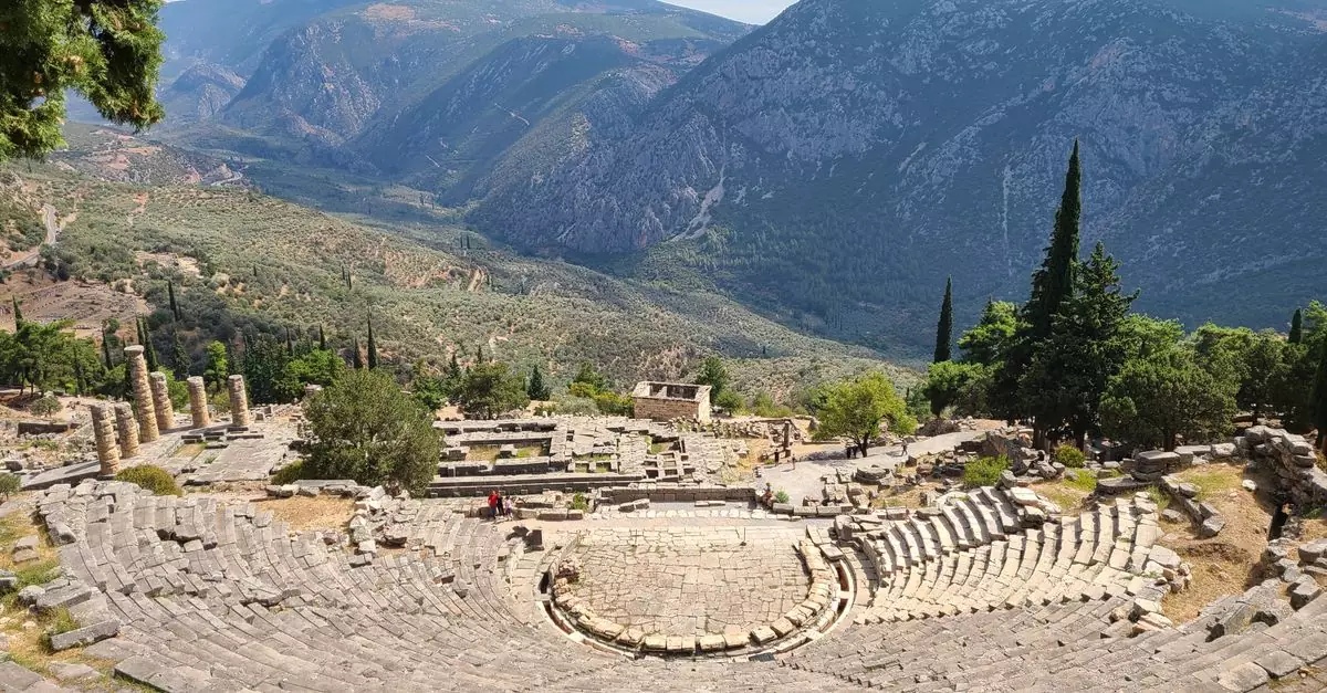 View of the Ancient Theater of Delphi set against the scenic mountains, showcasing classical Greek architecture.
