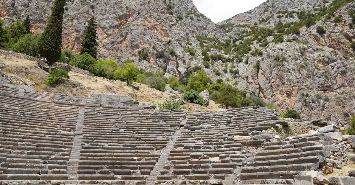 Explore the ancient ruins of the Greek theater at Delphi, nestled in the mountainous landscape.
