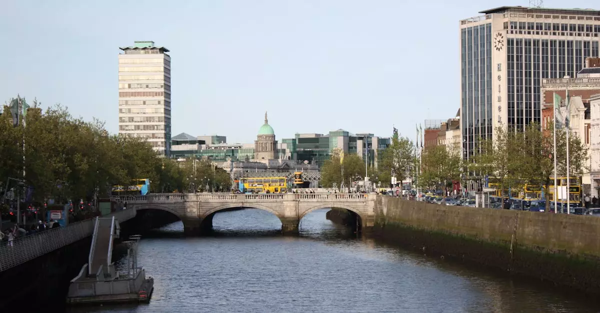 Scenic view of Dublin's O'Connell Bridge over the River Liffey on a sunny day.