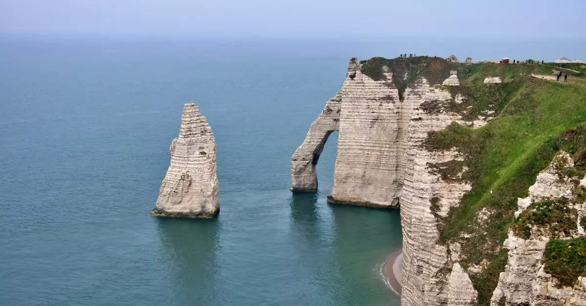 Breathtaking view of the iconic limestone cliffs at Étretat, Normandy, France.