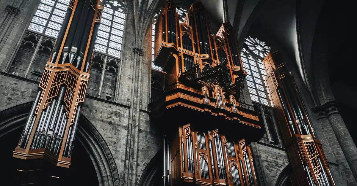 Majestic pipe organ in a Gothic cathedral, highlighting architectural and musical grandeur in Brussels.