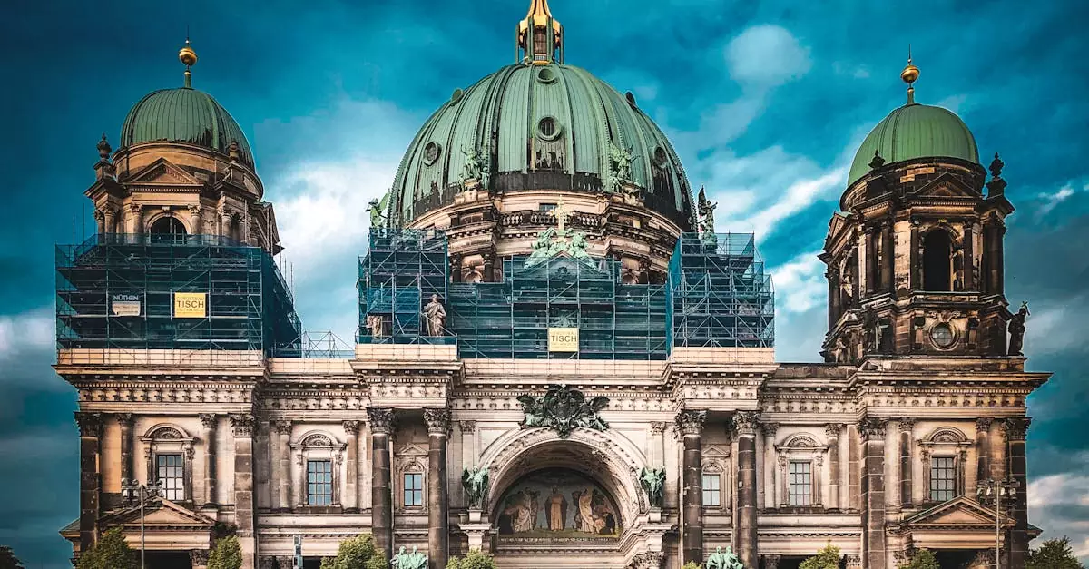 Front view of Berlin Cathedral with scaffolding against a dramatic sky.