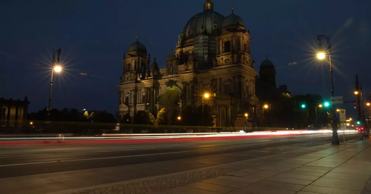 Stunning night view of Berlin Cathedral with dynamic light trails in Berlin, Germany.