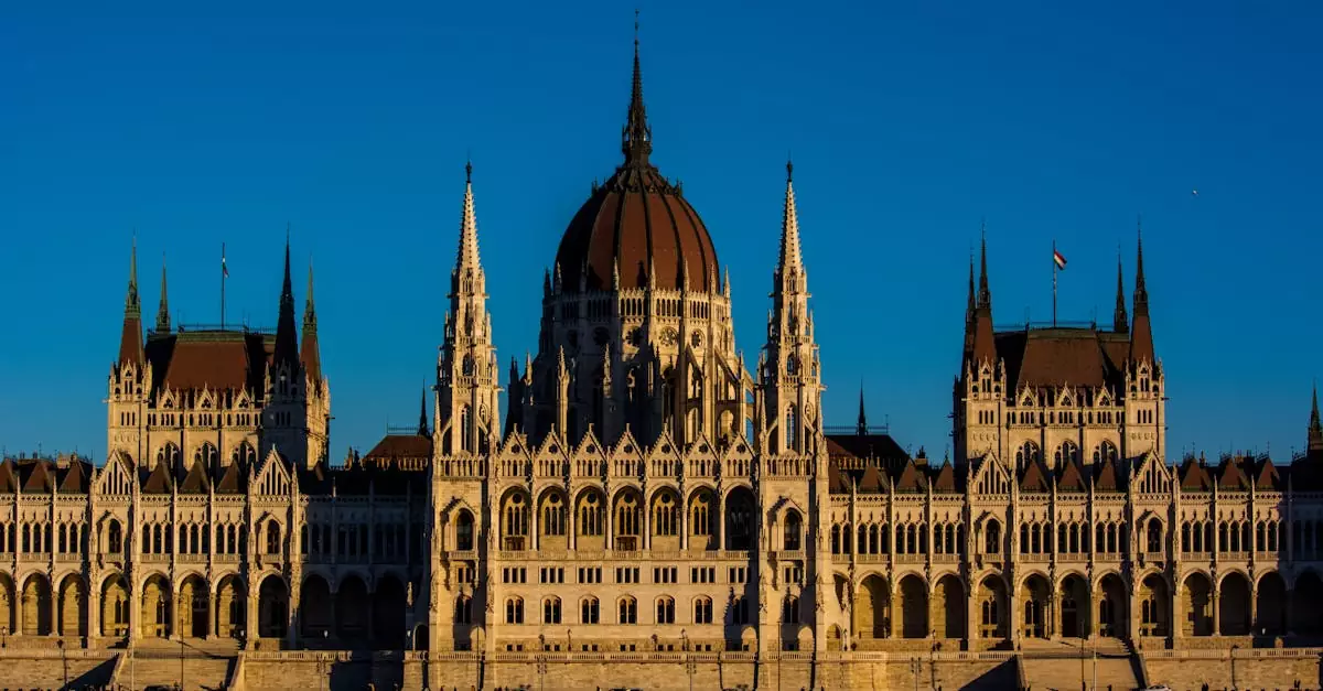 Breathtaking view of the Hungarian Parliament Building bathed in warm sunset light, showcasing its Gothic Revival architecture.