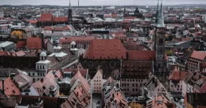 Aerial view of Nuremberg, Germany showcasing its historic architecture and vibrant cityscape under cloudy skies.