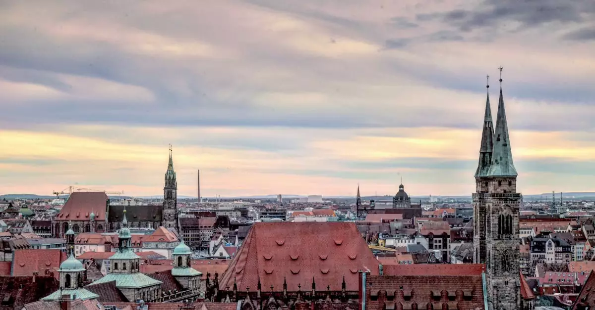 A stunning view of Nuremberg's historic skyline with iconic church towers and a vibrant sky.